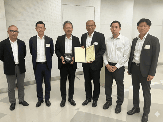 Synergy Marine Group leadership team receiving NYK Dry Bulk Award 2025 for KEY JOURNEY in Japan ceremony