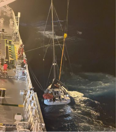 KUFRA’s crew deploy a personnel-transfer basket to recover four people from the disabled sailing yacht II TENDER in gale-force conditions in the Atlantic.